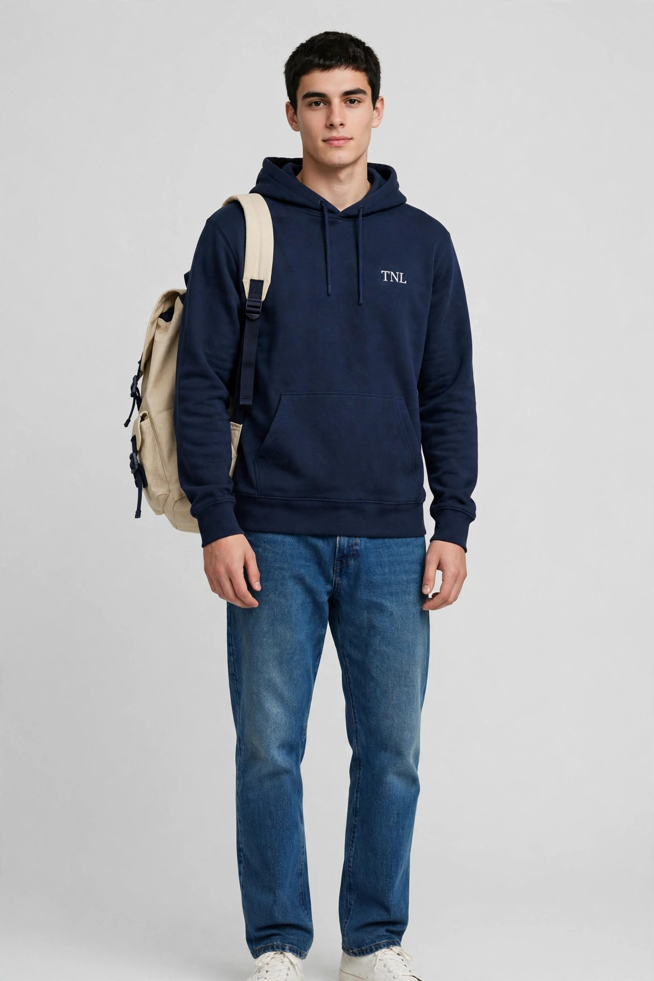 Man wearing the TNL Campus Backpack in canvas